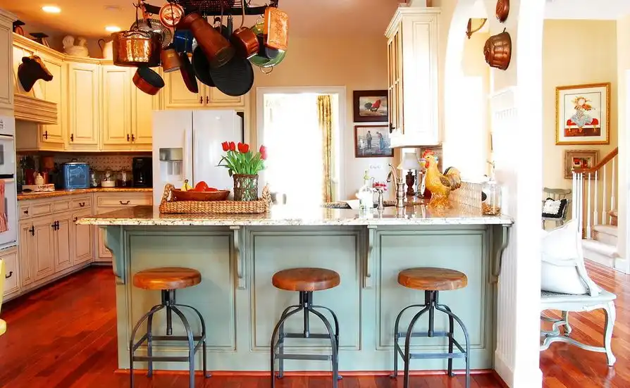 Country kitchen with turquoise accents and industrial stools