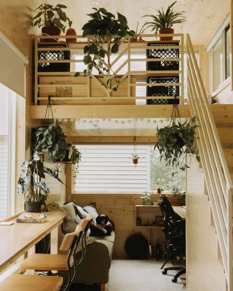 The area underneath the loft has a corner desk and a cozy lounge nook