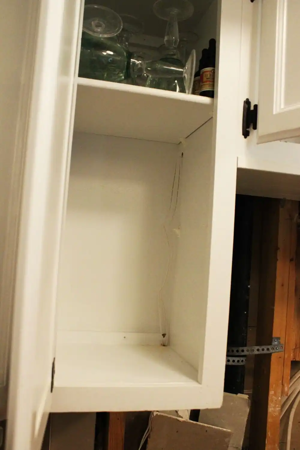 drill a hole through the cabinet wall