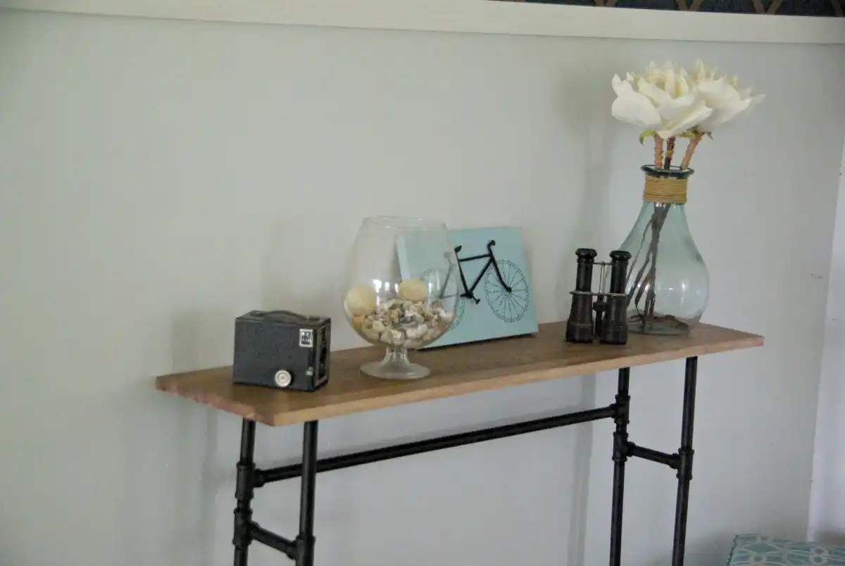 Finished console table from pipes and wood