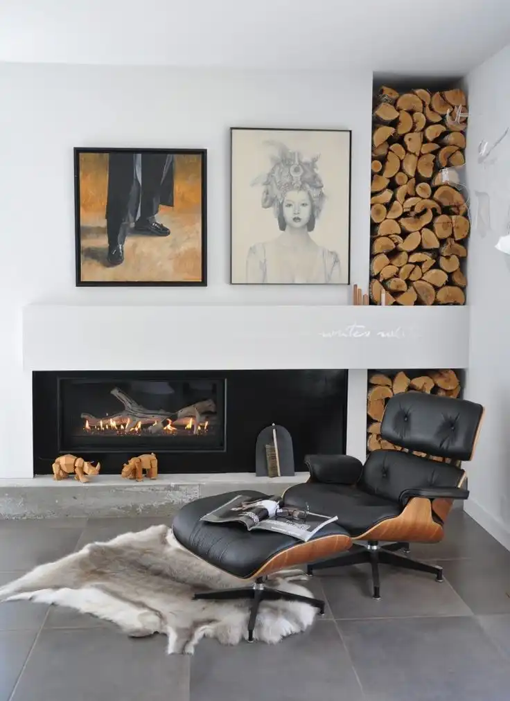 Fireplace reading corner iconic eames chair and firewood storage