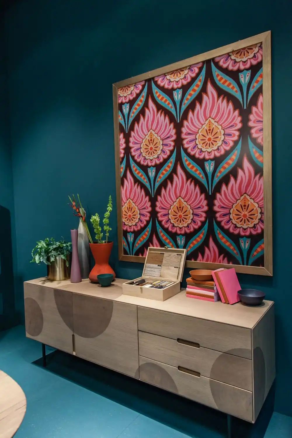 Floral leaf patterns framed above the sideboard