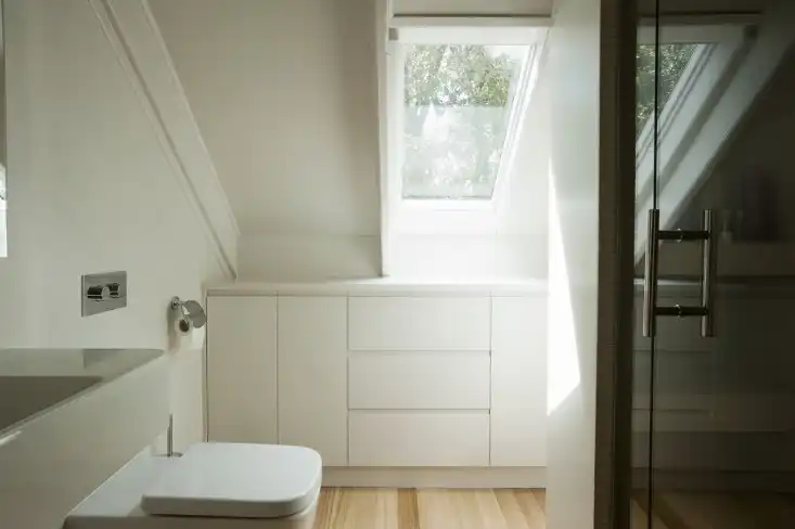 Garage studio apartment by Karin Montgomery Spath bath skylight