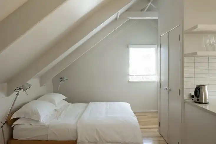Garage studio apartment by Karin Montgomery Spath bedroom