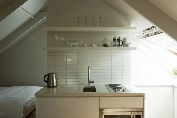 Garage studio apartment by Karin Montgomery Spath kitchen
