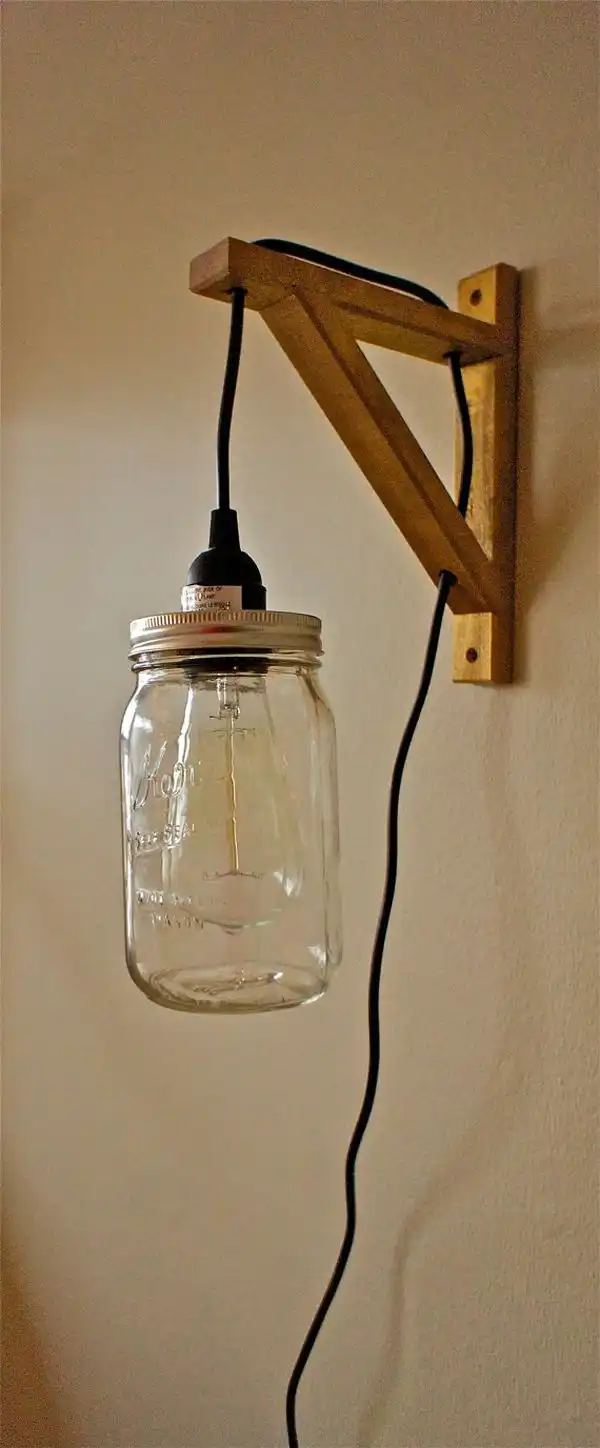 Hanging mason jar wall sconce