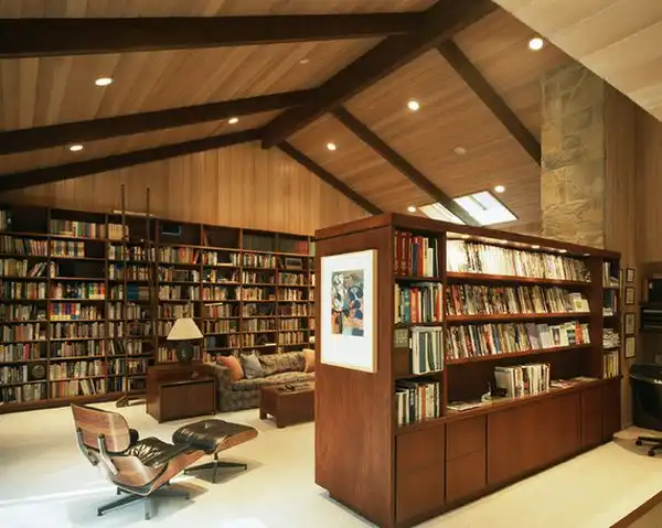 Home library featuring eames armchair for a comfortable reading