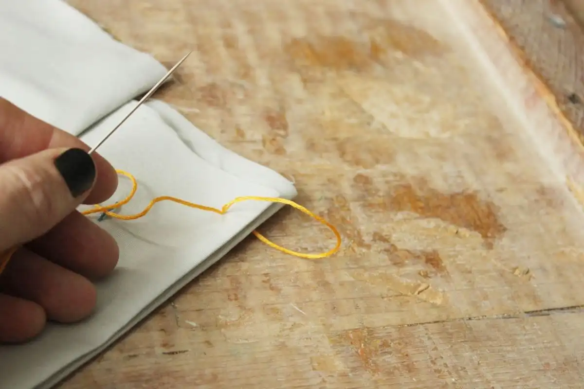 keep a small loop of thread out