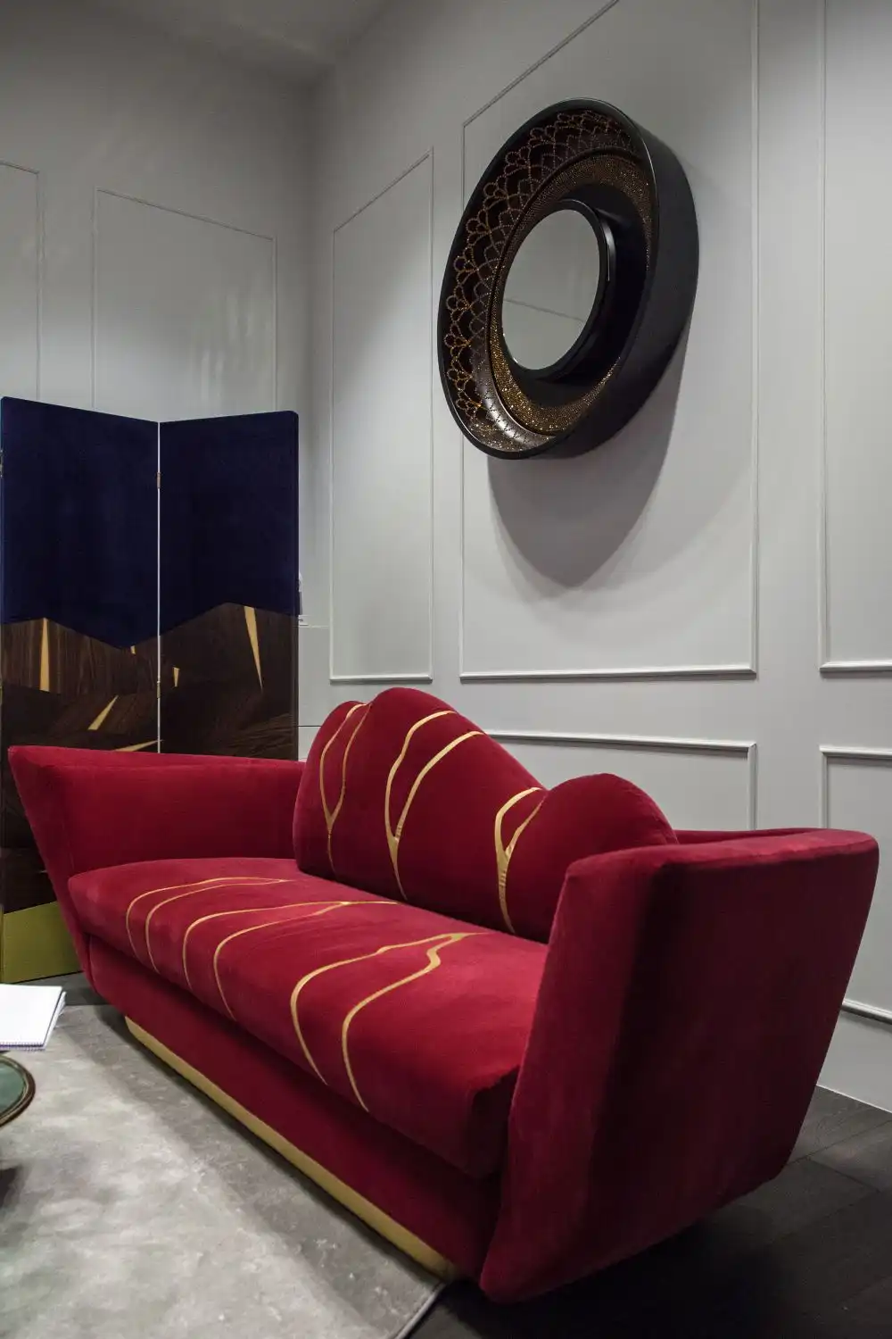 Kintsukuroi red sofa with some gold insertions