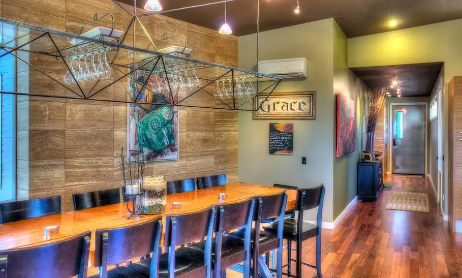 lighting-fixture-over-dining-table-with-wine-glass-rack