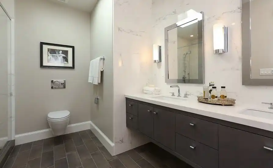 Marble around mirror and floating toilet for bathroom