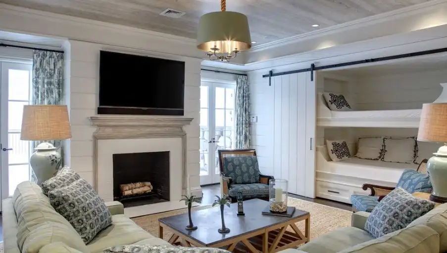 multifunctional room featuring bunk beds behind the barn door