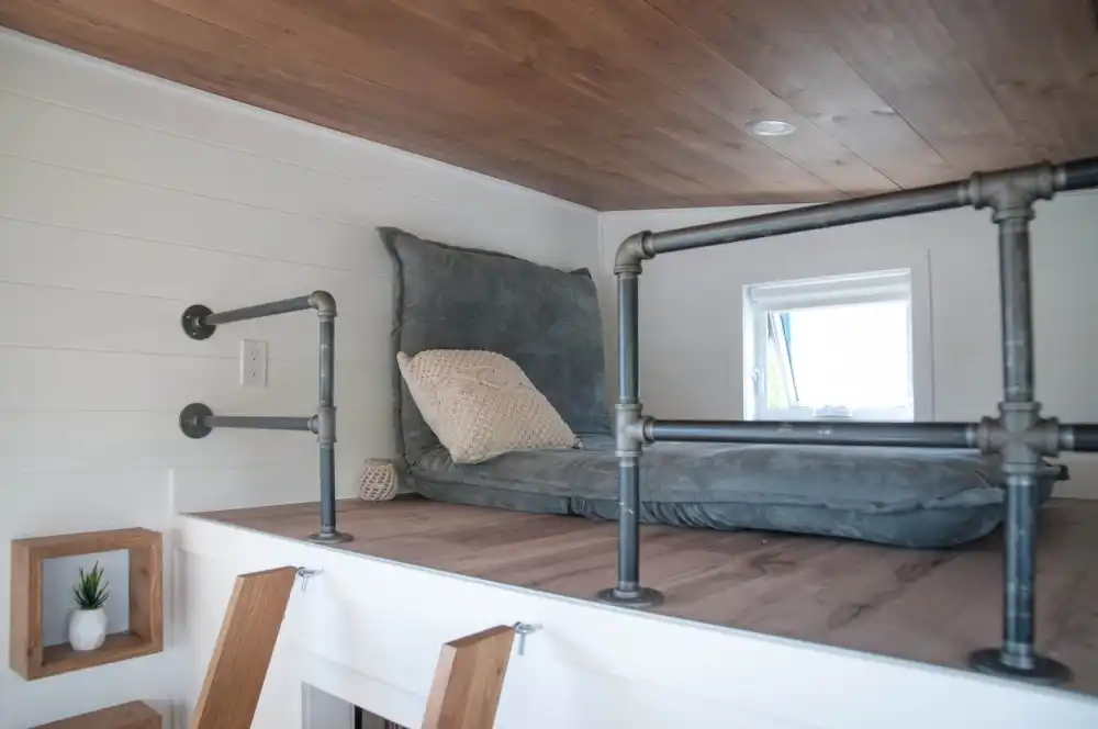 Off grid Eucalyptus tiny home pipes loft area