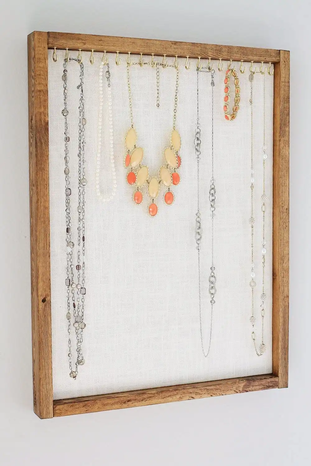 old frame can be repurposed into a necklace holder