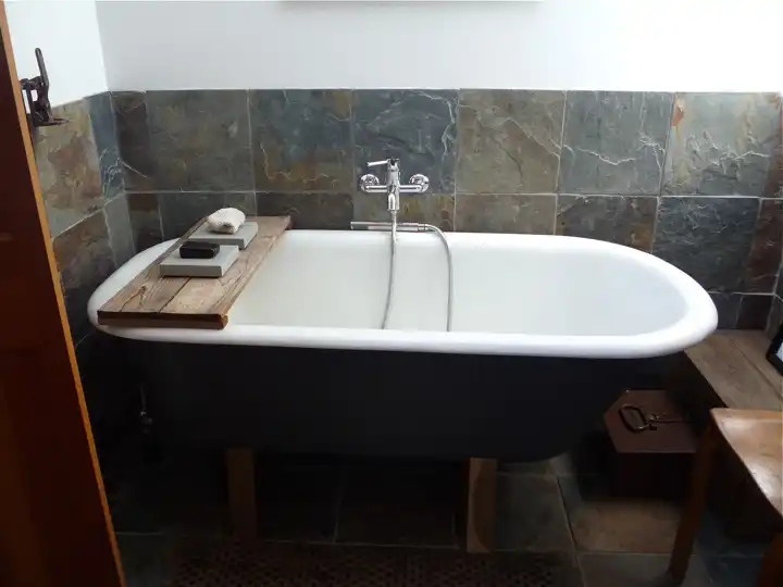 Old garage into a family home bathtub