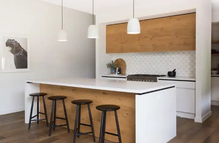 Open space kitchen featuring a backsplash from fish scale tiles