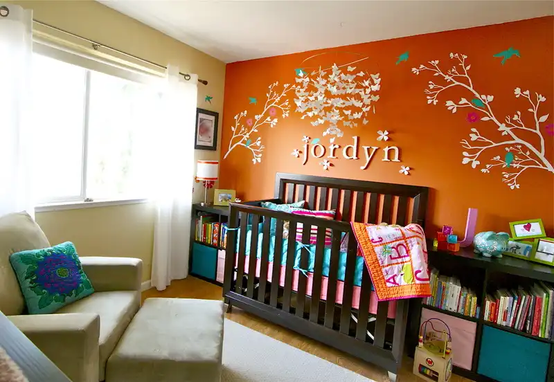 Orange nursery room wall design