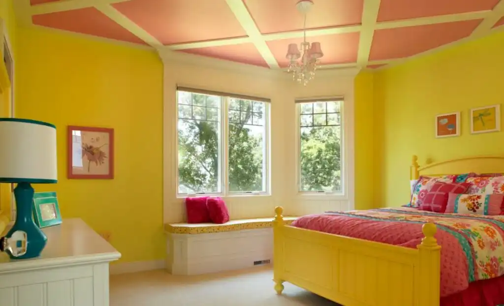 Pink and yellow room with window seat 1024x622
