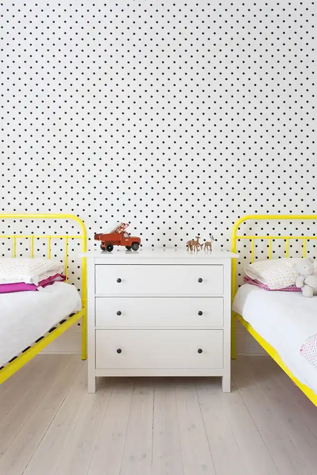 Polka dots wallpaper for shared bedroom yellow frame bed