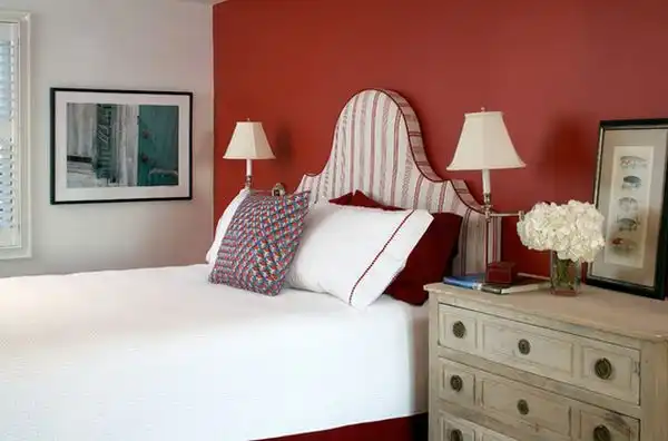 Red wall above bed