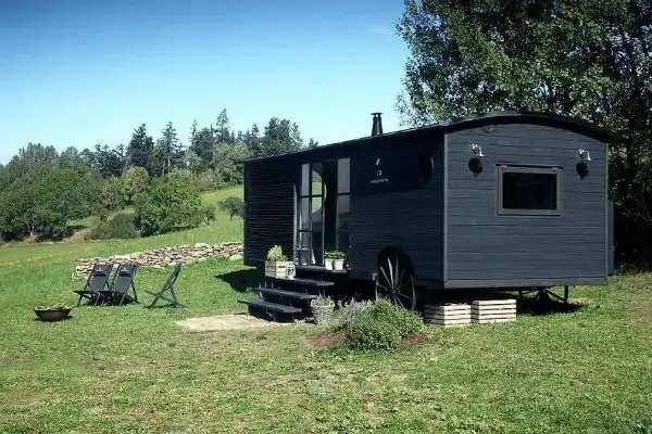 Rustic black house on wheels