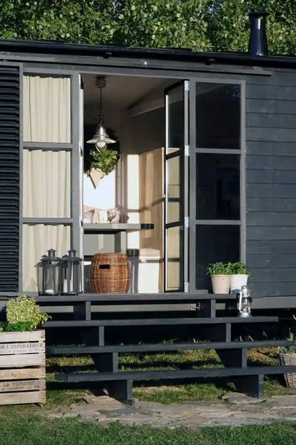 Rustic black house on wheels1