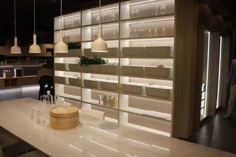 Sometimes you want your kitchen lighting fixtures to blend in and not be a focal point. These white pendants in a Scavolini kitchen are a wonderful size and work well in the monochromatic design.