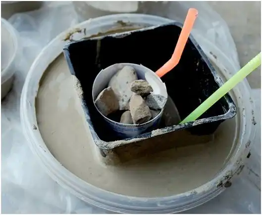 Straws rocks in cement