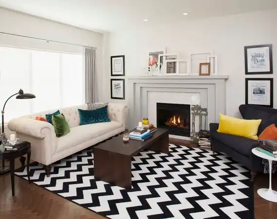 Striped chevron rug and empty frames on mantel