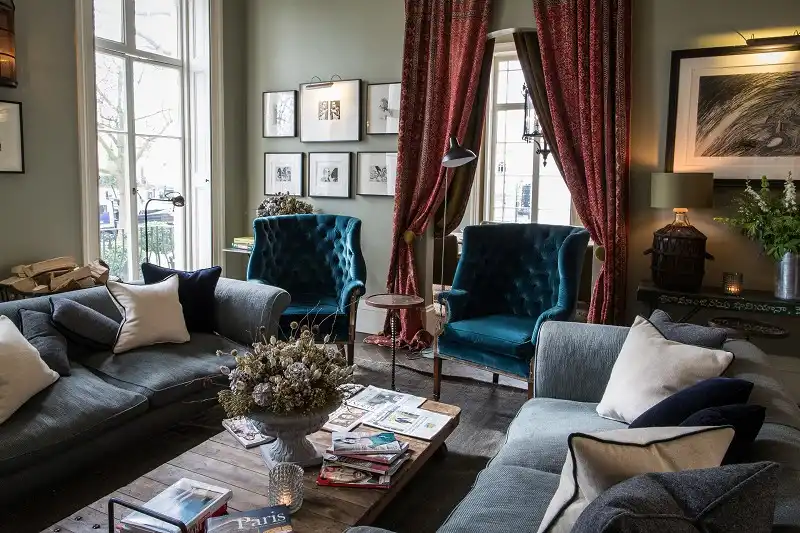 sumptuous living room design with tufted armchairs