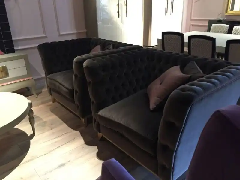 sumptuous tufted armchairs