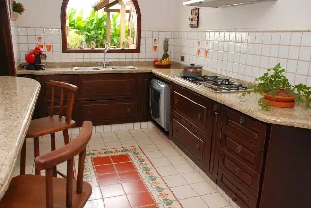 Traditional kitchen featuring patchwork tiles floor