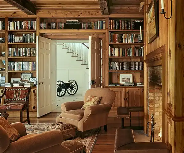 Traditional wood accents living room space above door