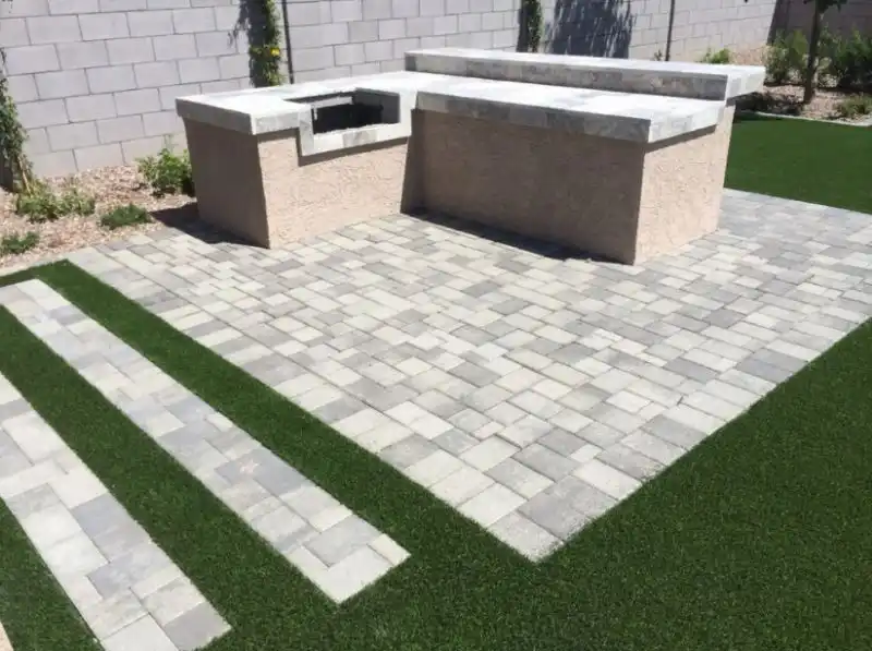 Trendy backyard stone patio kitchen design