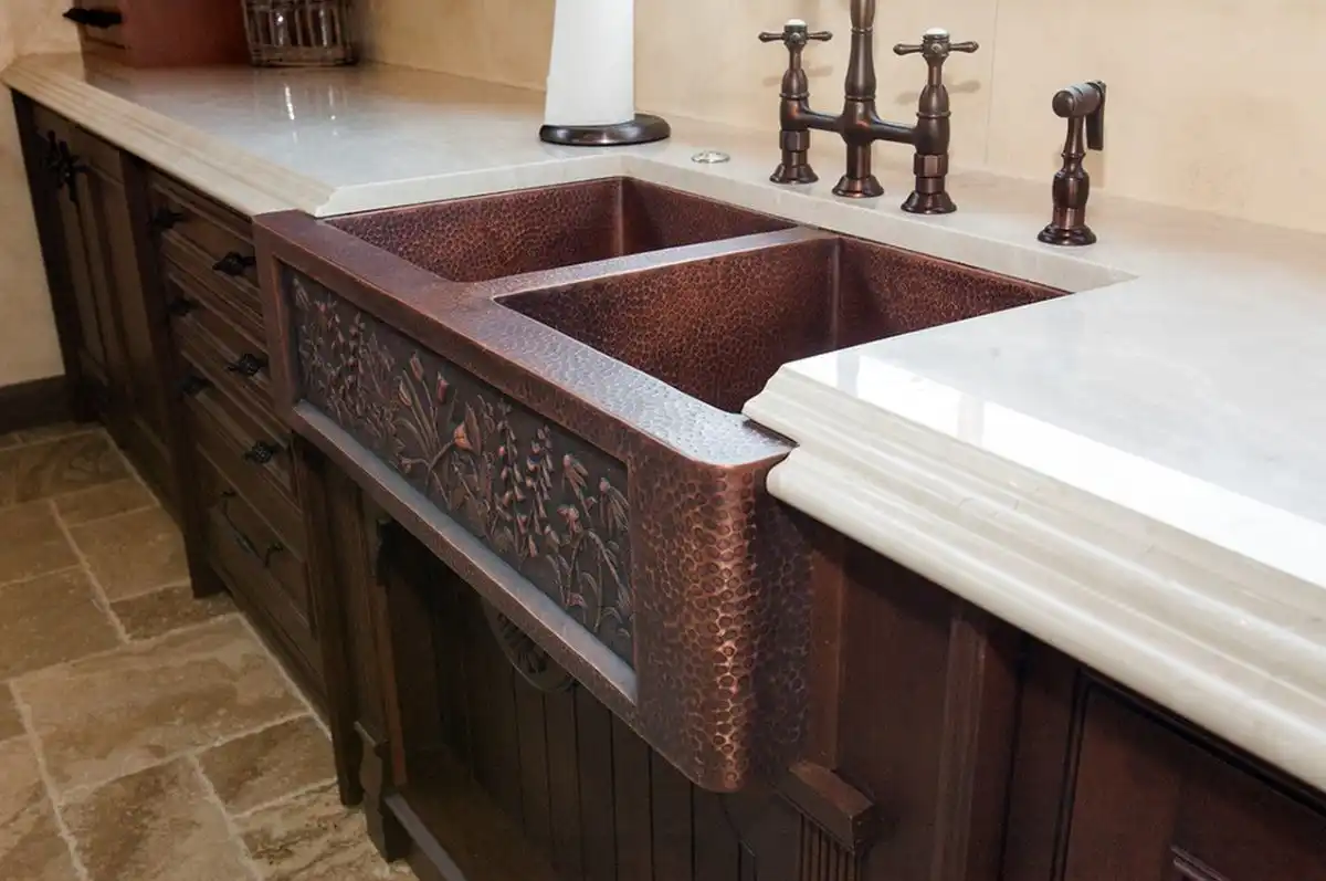 vine-design-on-copper-sink