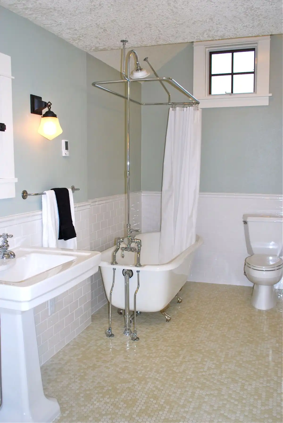 wainscoting tiles on the walls and penny tiles on the floor