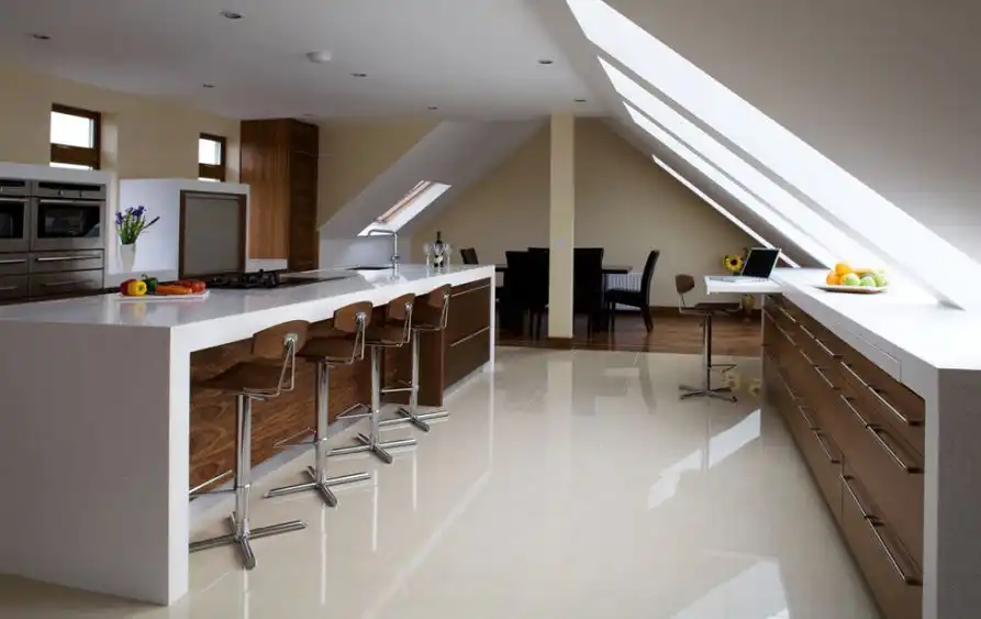 White attic ktichen with counter stools