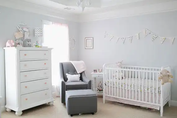 White pink accents nursery room