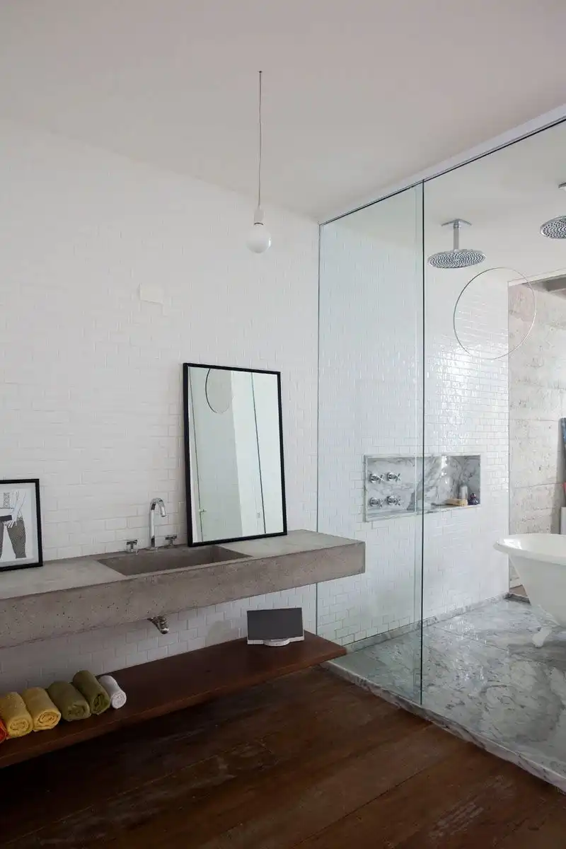 wooden shelf under the concrete countertop