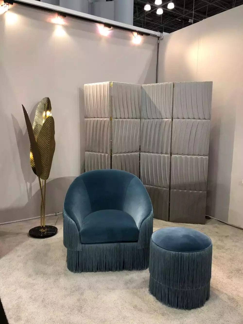 Armchair with ottoman in blue shade velvet