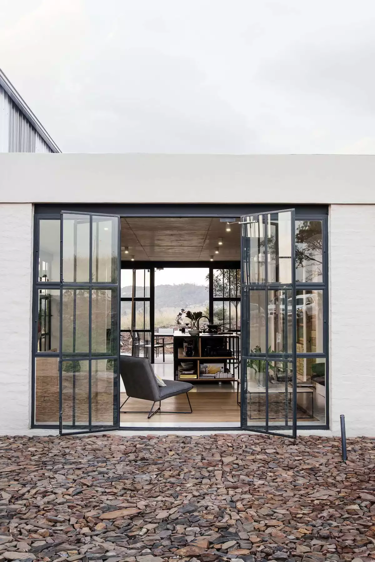 In the summer, the doors and some of the facade walls can be opened to allow natural ventilation and access to the patio