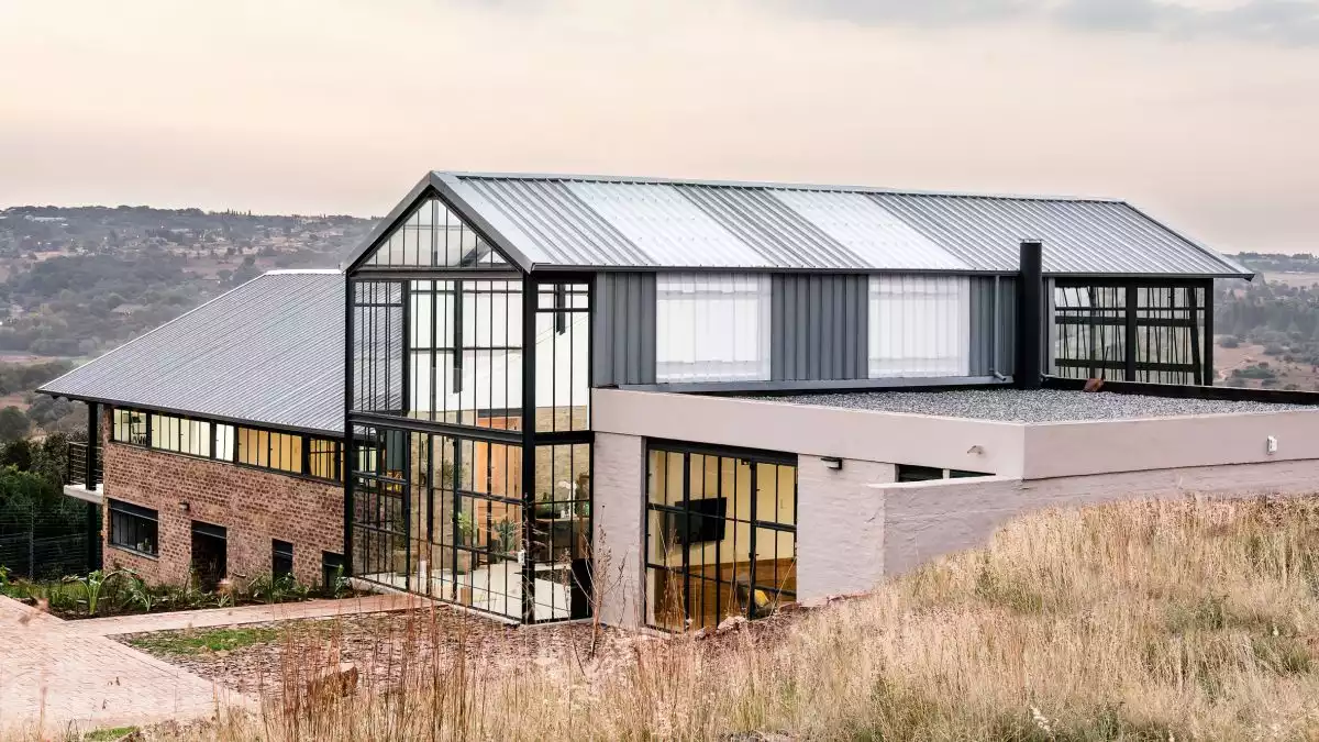 Cool House Features A Large Conservatory Volume At Its Core