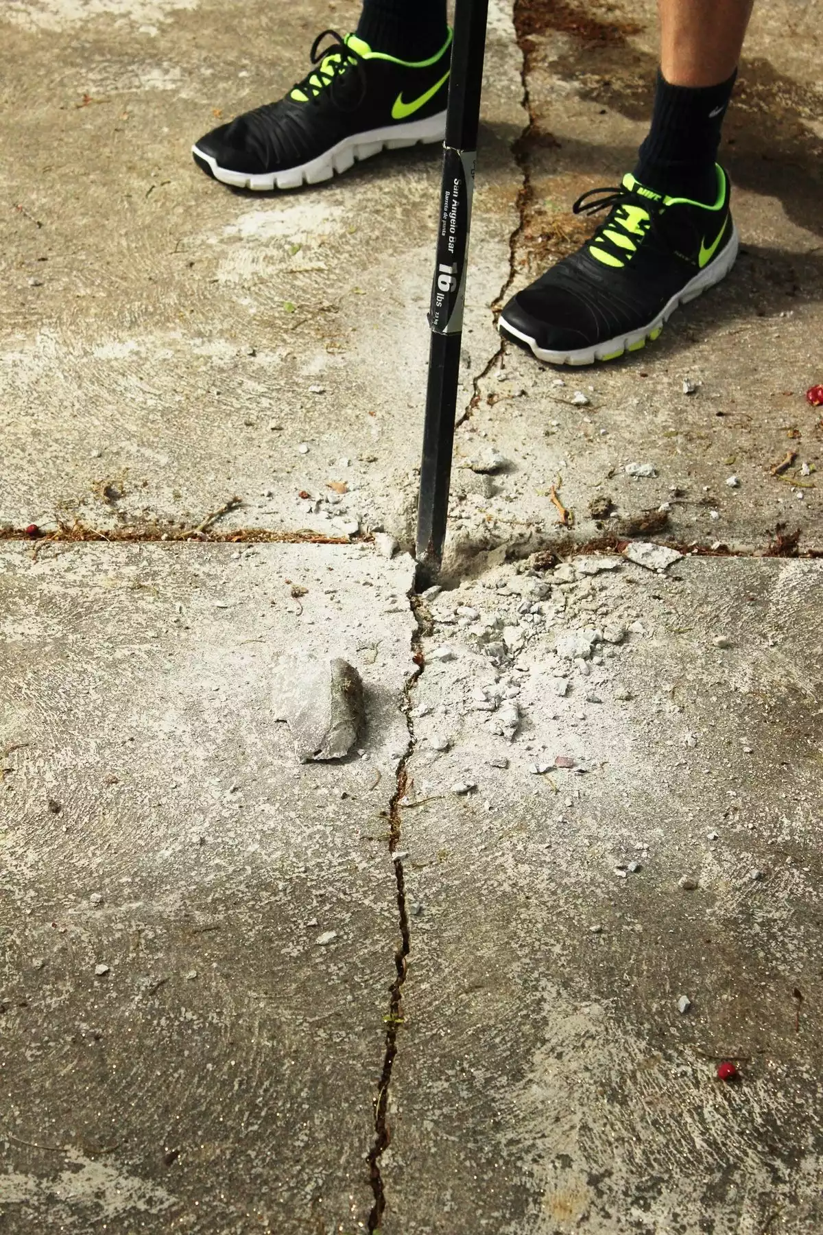 Best Way to Remove Concrete Slabs on a Patio pry bar