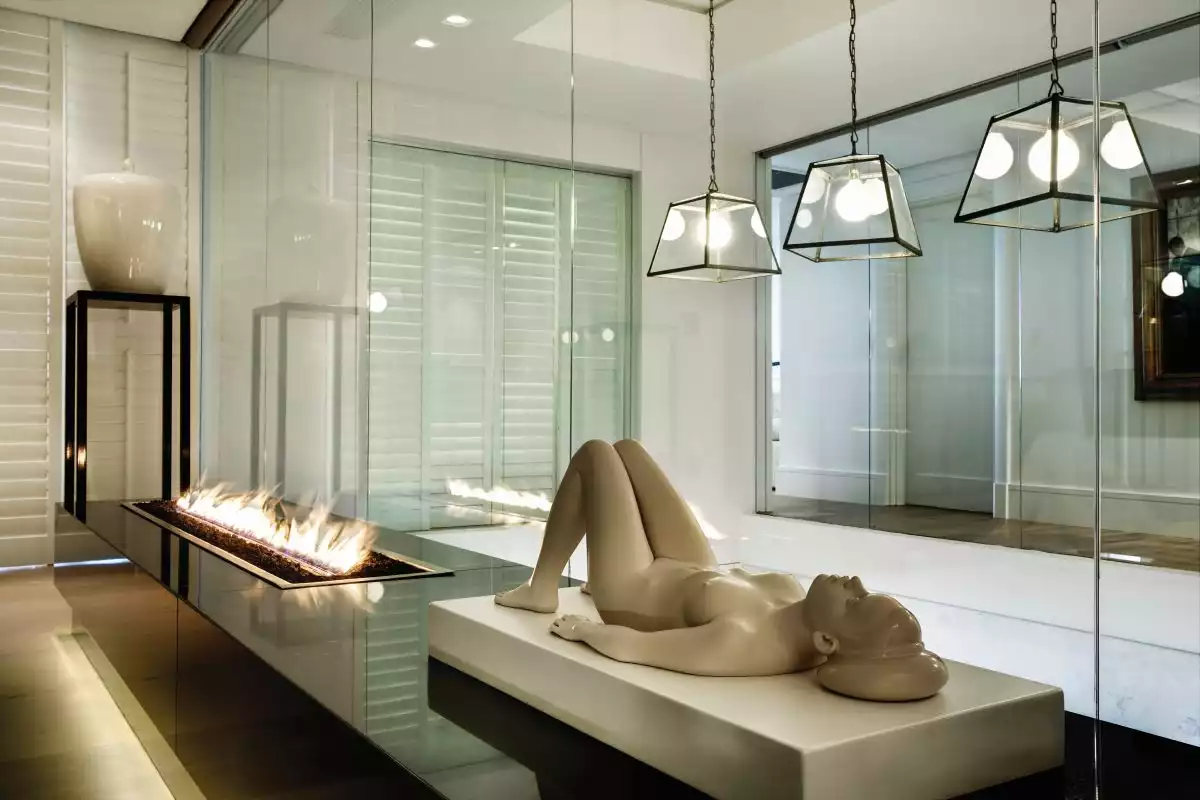 Numerous sculptures seamlessly blend in with the luxurious decor, adding a touch of opulence to the spaces