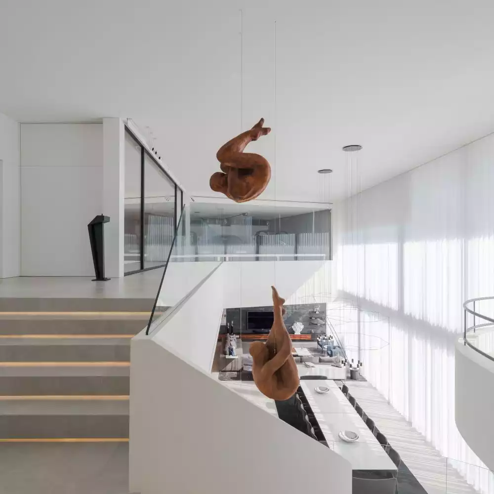 These two sculptures are the focal points of the social area's decor, being visible from both floors