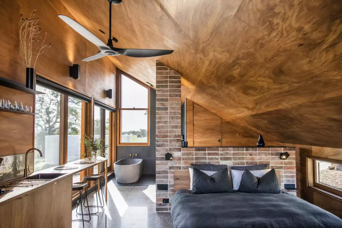 The timber-paneled walls and ceiling make the interior of the hut feel very warm and inviting