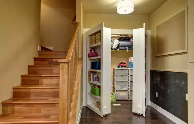 Hidden closet behind big bookcase