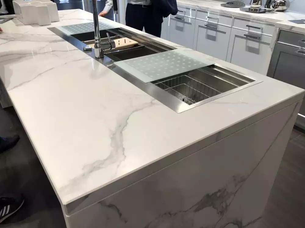 Kitchen island featuring Carrara Marble