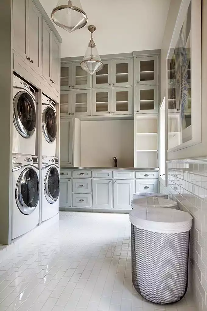 Large laundry room with stacked waching machines