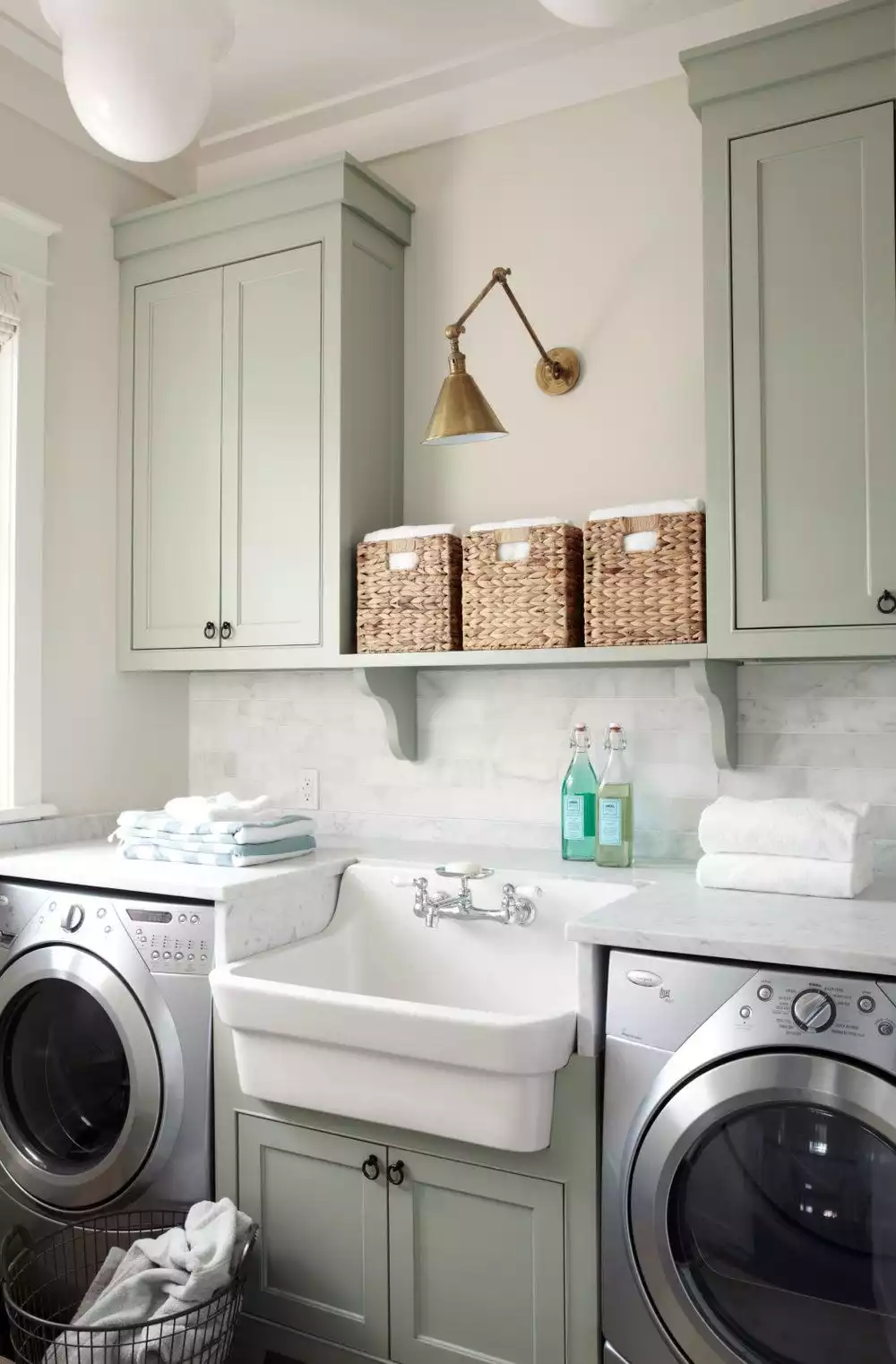 Laundry room with two sided washing machine